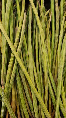 winged beans in green color in market