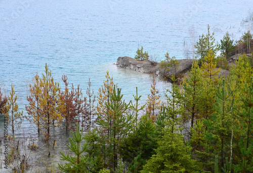 Chalk quarry artificial lakes in autumn season. Technogenic open pit is known as the Belarusian Maldives, which is in great demand among tourists from around the world photo