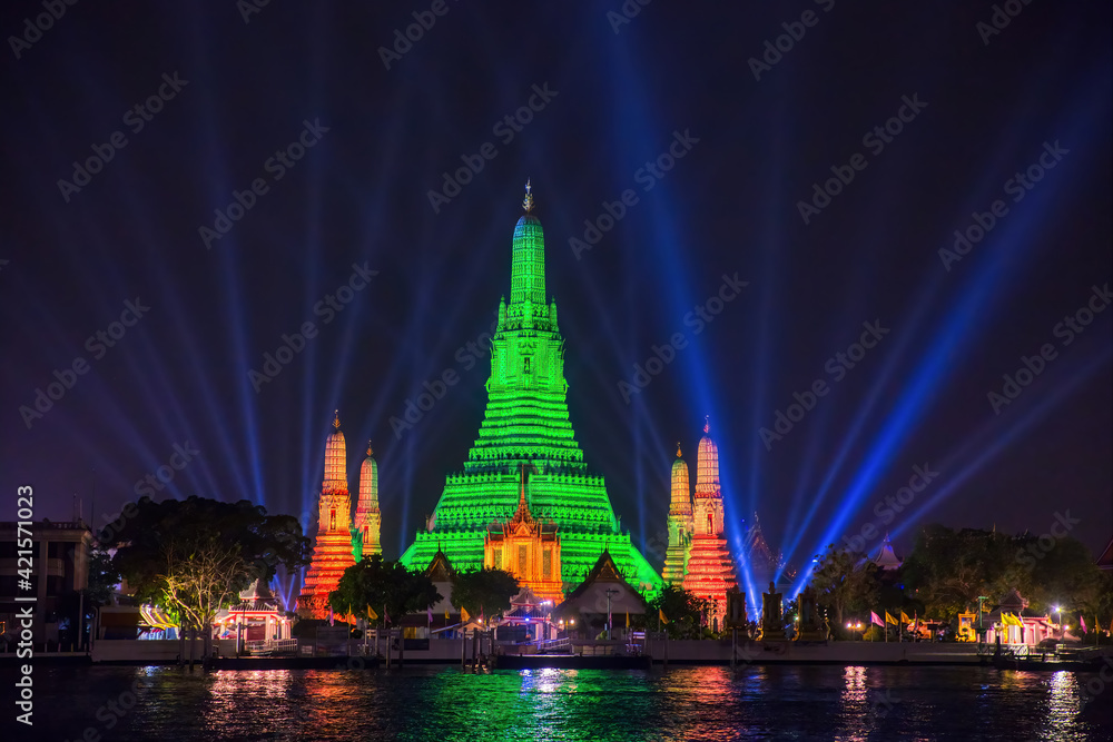 Naklejka premium Wat Arun in green to celebrate St. Patrick's Day 2021, Bangkok Thailand