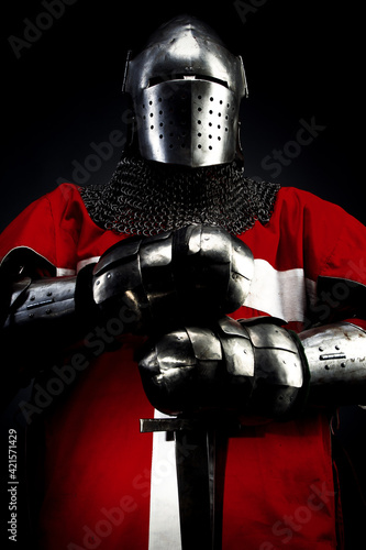 Knight with sword and red checkered shield.