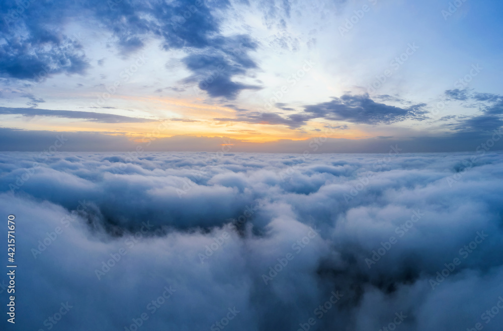 Beatuful dawn sky over clouds high.