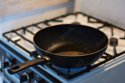close-up photo of a wok on the stove