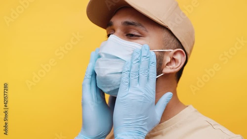 Young man adjusting medical face mask. Prevention of the covid 19 spread. High quality 4k footage photo