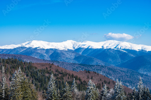 Snowy mountain range in Romanian Carpathians near Brasov