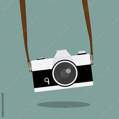 Vintage camera on color background. Retro style toned picture. Minimalistic concept