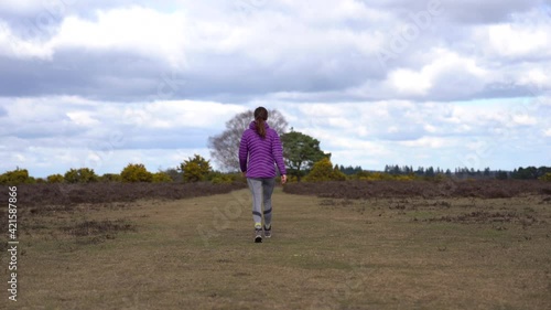 Woman walking in forest