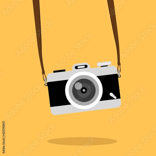 Vintage camera on color background. Retro style toned picture. Minimalistic concept