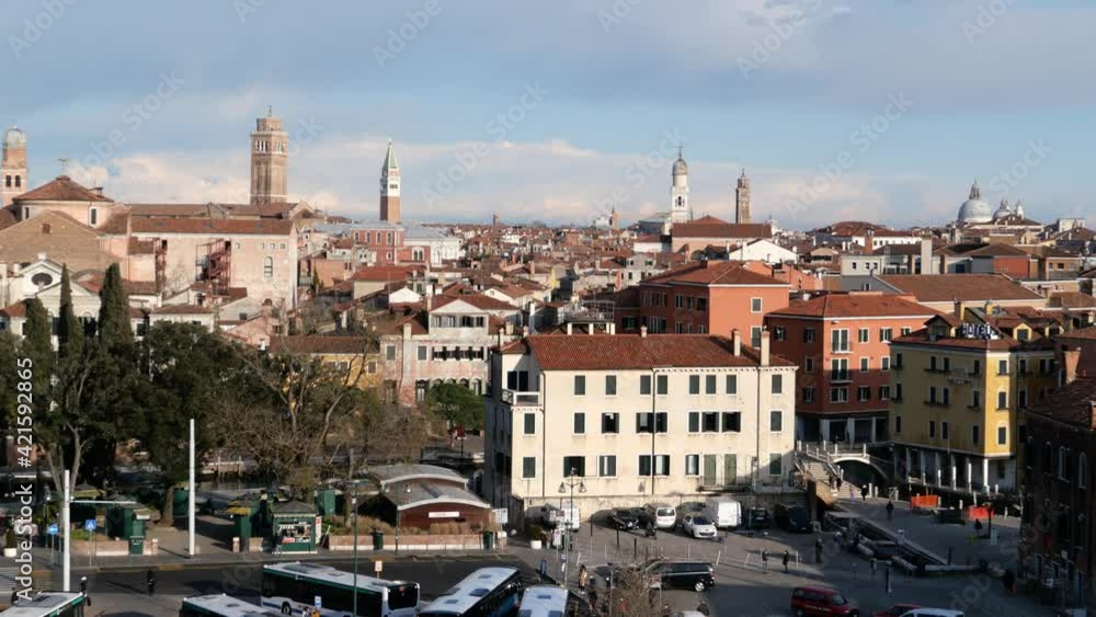 Venice, Italy - Panorama of the lagoon city, overlooking the red-tiled roofs and bell towers Venice, Italy - Panorama of the lagoon city, overlooking the red-tiled roofs and bell towers