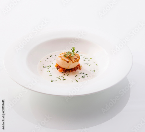 scallop in a white dish