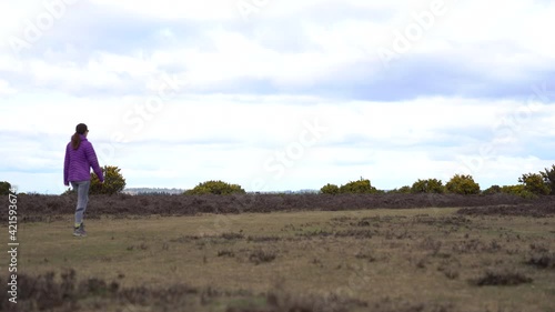 Woman walking in forest