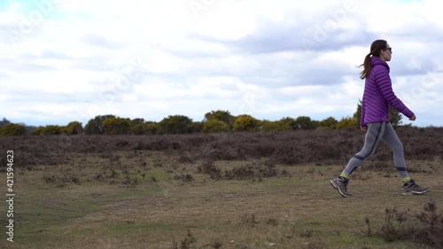 Woman walking in forest