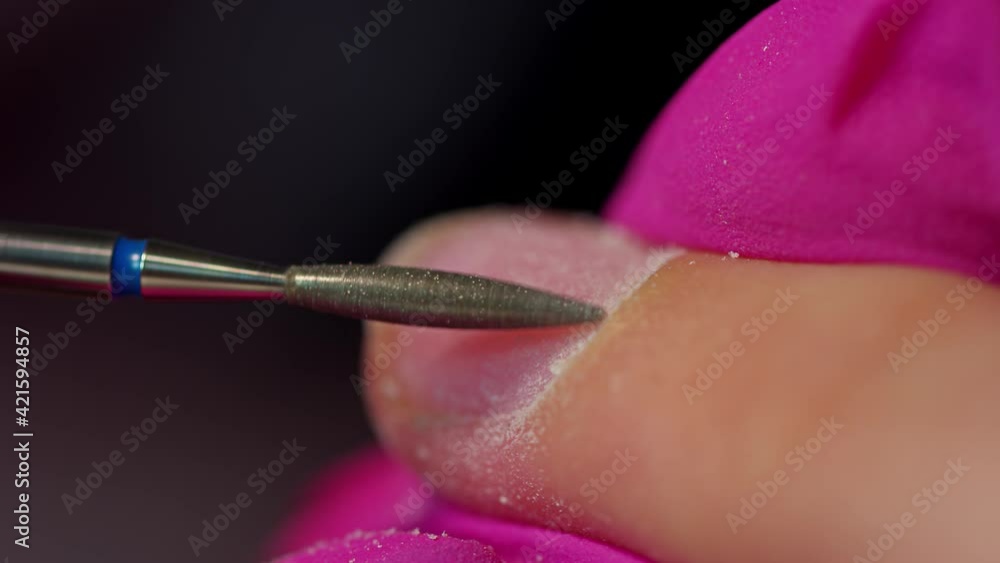 Nail Cleaning by a milling cutter slow motion macro close up footage. Beauty and fashion work. Manicure artist. Woman in salon and procedure. Nail Cleaning by a milling cutter slow motion macro close up footage. Beauty and fashion work. Manicure artist. Woman in salon and procedure.