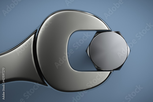 Open end wrench and matching bolt. Close-up. Compatibility concept.