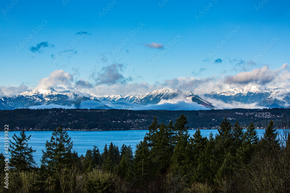 Hood Canal, Washington State. Olympic Mountains, fresh snow, clouds and fog