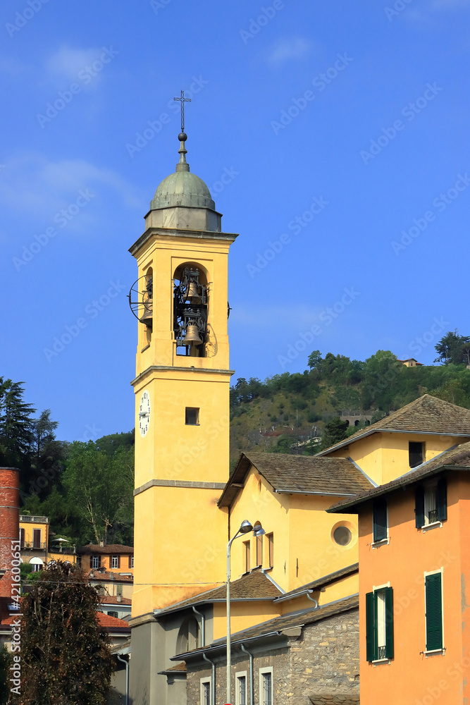 vecchio campanile di una chiesa a como in italia, old bell tower of a church in como in italy