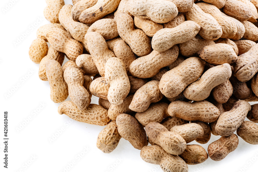 Organic peanuts in shell isolated on white background. Heap of peanut closeup. Peanuts in shells. Pile of raw peanuts in shells. Organic peanuts in shell isolated on white background. Heap of peanut closeup. Peanuts in shells. Pile of raw peanuts in shells.