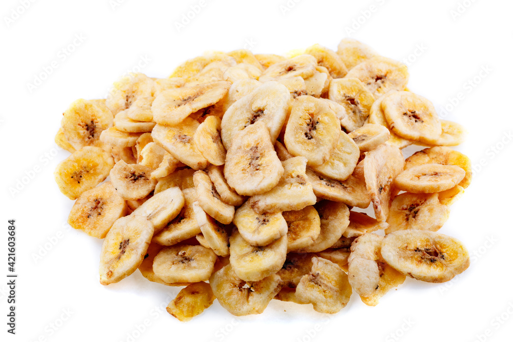 Dried bananas. Banana chips, dehydrated slices of fresh ripe bananas as food background.
