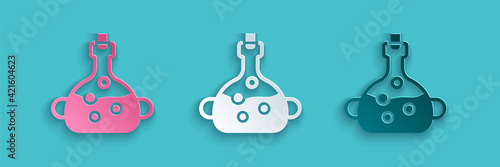 Paper cut Poison in bottle icon isolated on blue background. Bottle of poison or poisonous chemical toxin. Paper art style. Vector