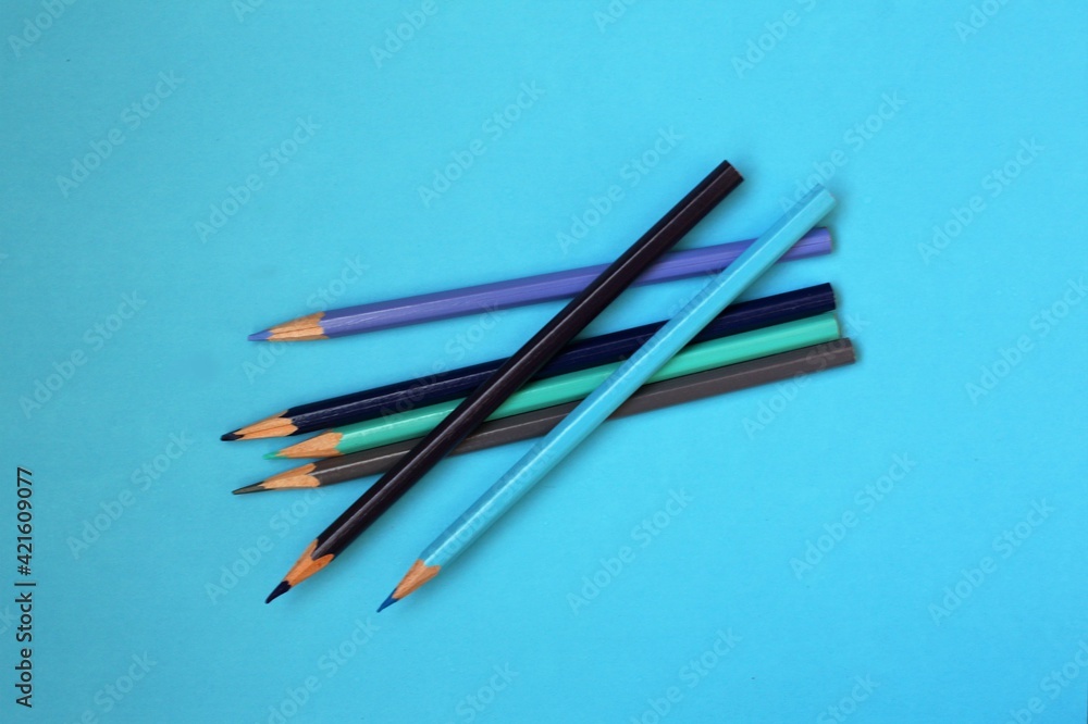 pencils on blue background pencils on blue background