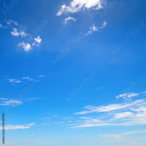 Bright blue sky with clouds.