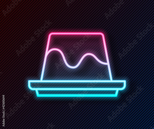 Glowing neon line Pudding custard with caramel glaze icon isolated on black background. Vector