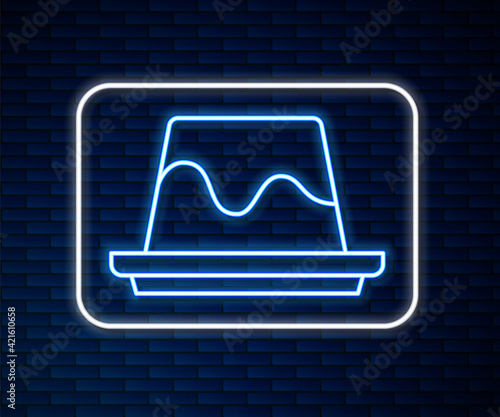 Glowing neon line Pudding custard with caramel glaze icon isolated on brick wall background. Vector
