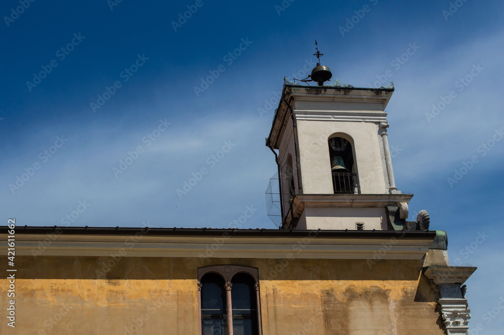Old tower with a bell. Italy.