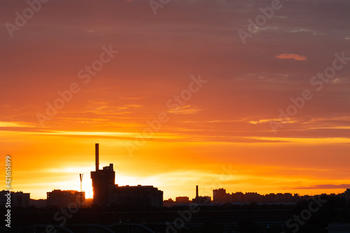 pink sunset sky and the outline of the city