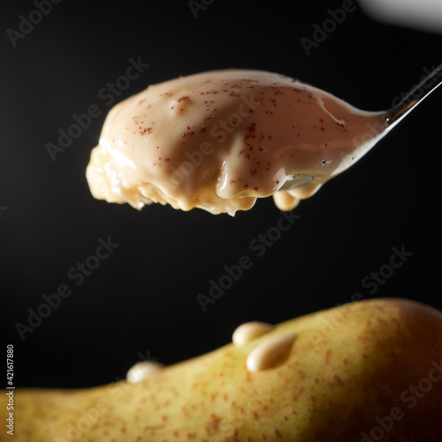 Pear ice cream on a spoon