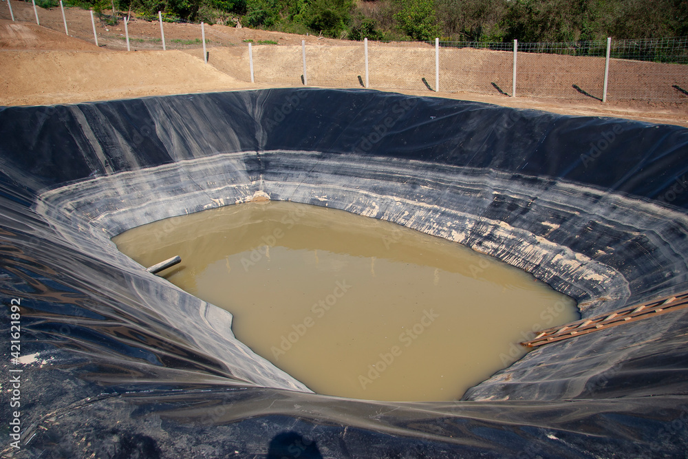 Insulated leachate pond with dirty water, part of landfill - obrazy, fototapety, plakaty 