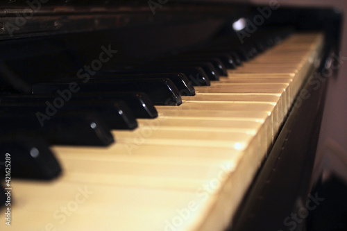 piano keyboard, art acoustic wooden old instrument black and white for playing music