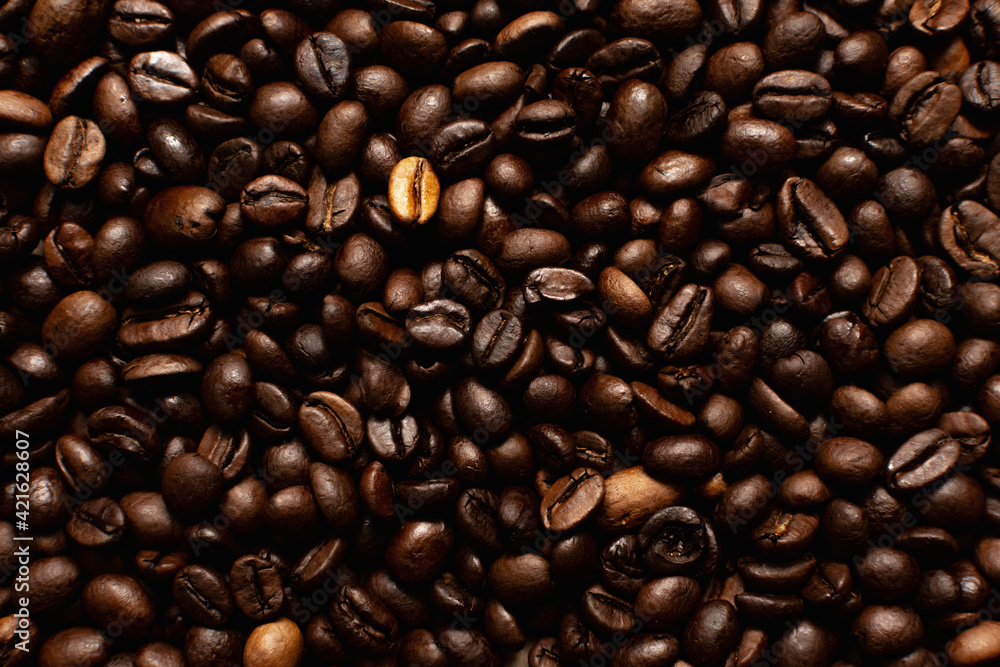 Coffee beans. Coffee beans are spread out on the surface. Coffee beans. Coffee beans are spread out on the surface.