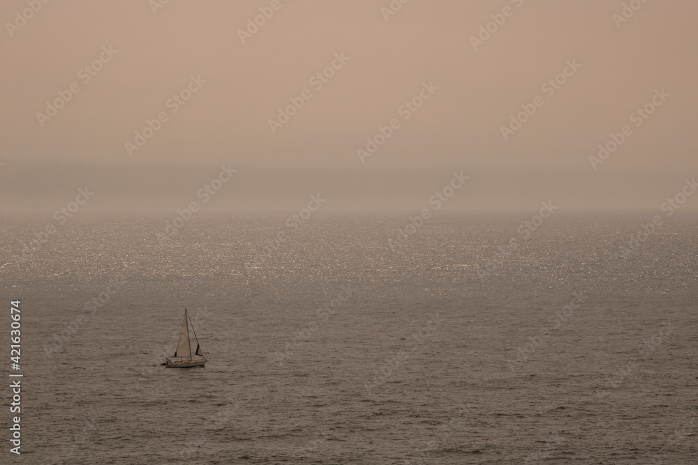 Lonely boat sailing