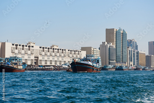Dubai creek and water traffic there: cargo ships, touristic boats and docked ships © dimo