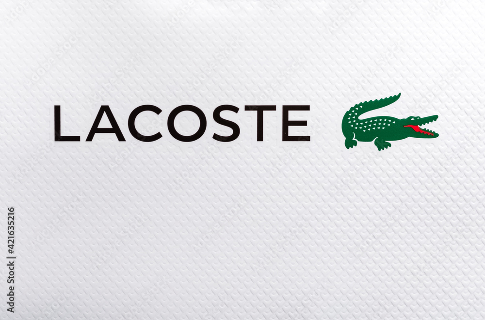 Lacoste logo on textured white background paper. Lacoste is a French  company, founded in 1933 Stock-Foto | Adobe Stock