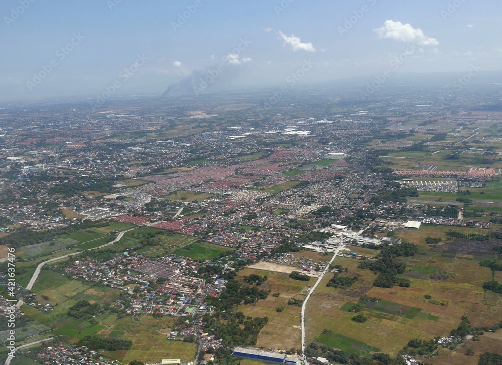 Aerial view of Manila, Philippines, seen from the window of an airplane.