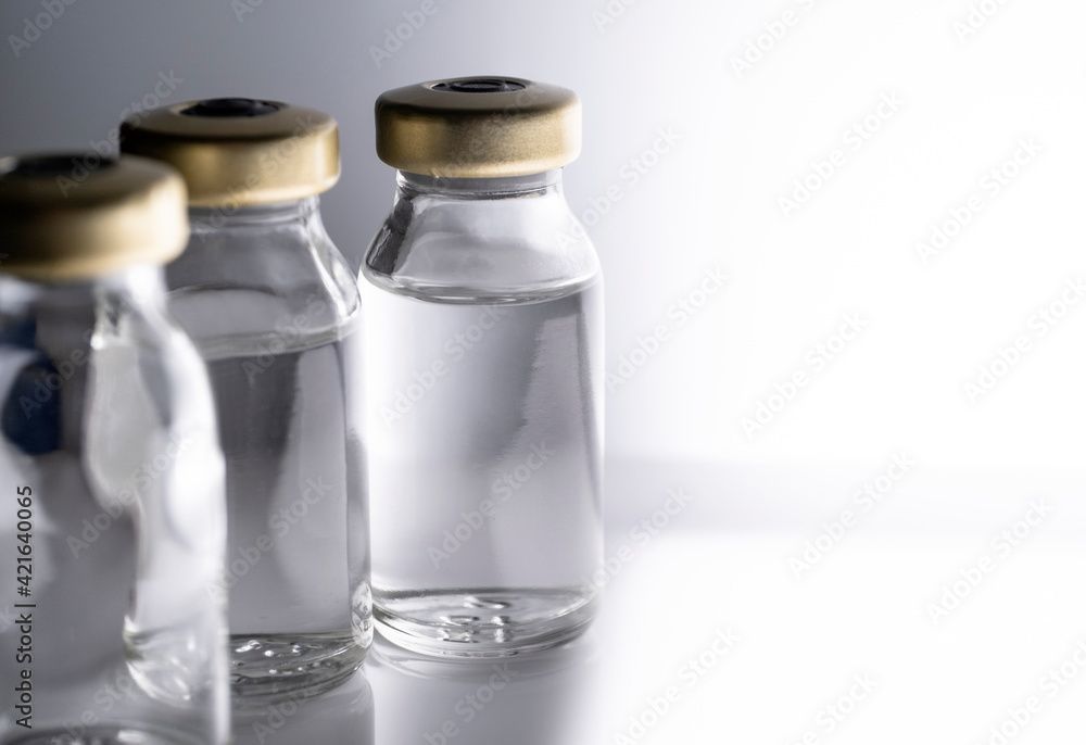 Studio shot of laboratory vials with liquid Studio shot of laboratory vials with liquid