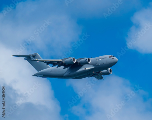 McDonnell Douglas/Boeing C-17 Globemaster III American Air Force cargo plane flying against sky