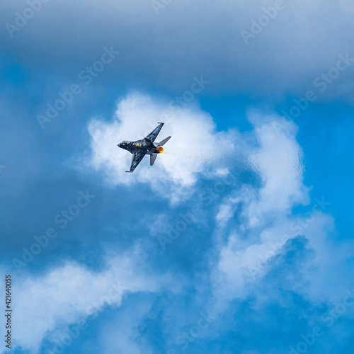 F-16 Fighting Falcon flying against sky photo