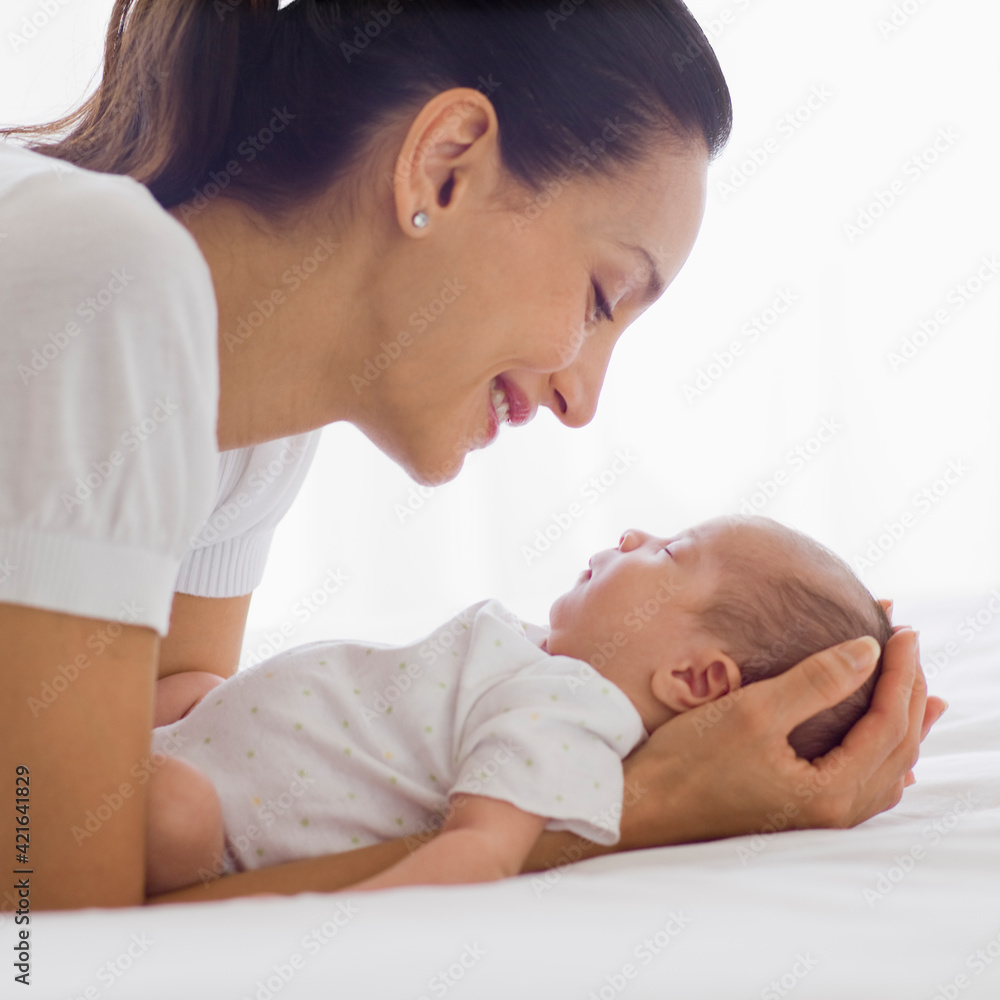 Mother holding her sleeping baby Mother holding her sleeping baby