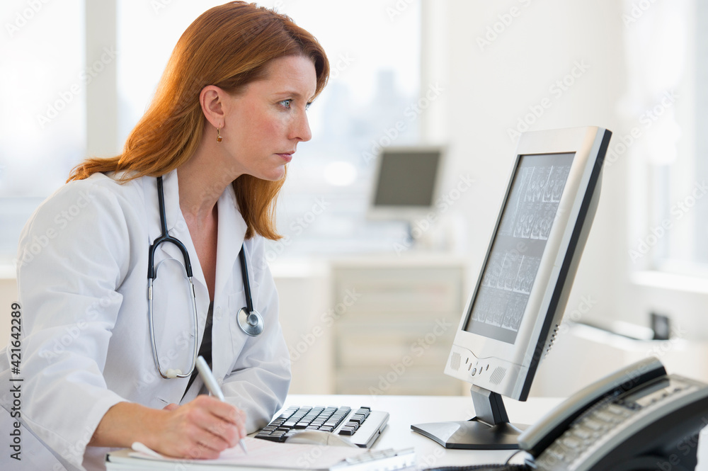 Doctor working at computer Doctor working at computer