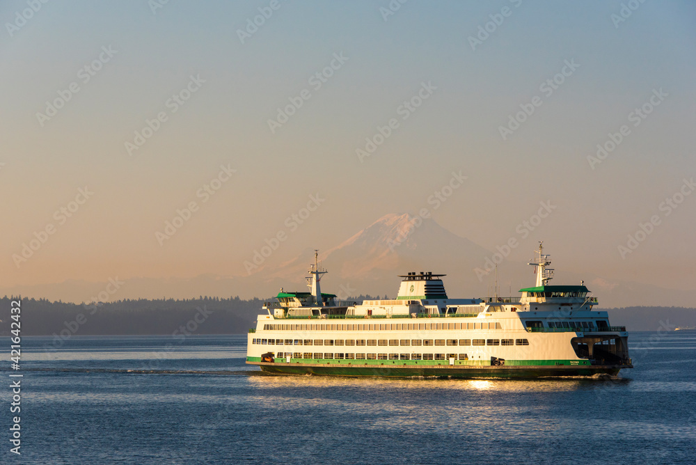 USA, Washington State, Puget Sound. Seattle Bainbridge ferry framing Mount Rainier on calm morning crossing.