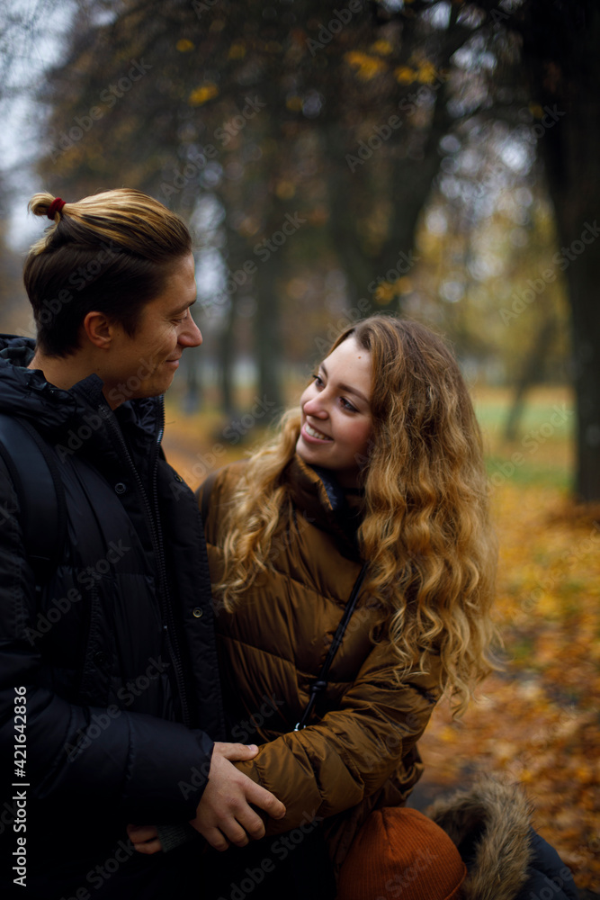 Caucasian guy with a girl laugh and smile looking at each other. young happy couple hugging in the park with yellow leaves on the background. friendship between a guy and a girl
Caucasian guy with a girl laugh and smile looking at each other. young happy couple hugging in the park with yellow leaves on the background. friendship between a guy and a girl