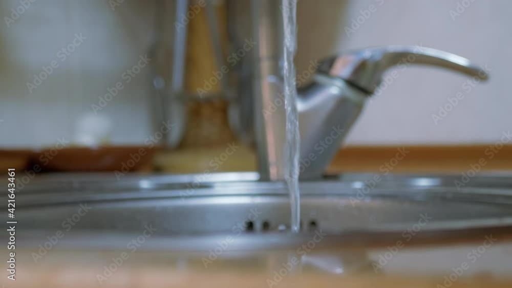 Female Hands Washing a Ripe, Red Apple, Bananas with Running Water from the Tap. Female Hands Washing a Ripe, Red Apple, Bananas with Running Water from the Tap.