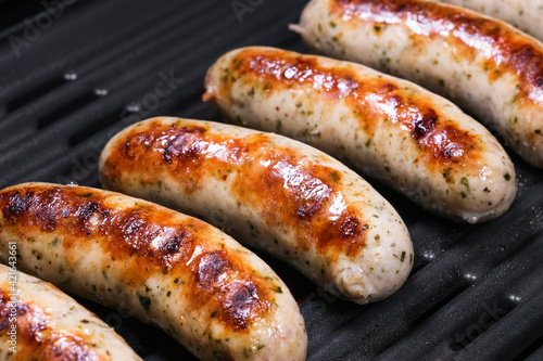 Bilde på lerret Delicious german sausages on the barbecue electro grill