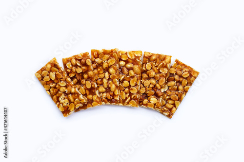 Honey bars with peanuts on white background