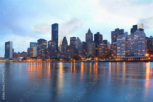 USA, New York State, New York City, Skyline with United Nations Buildings and United Nations Plaza at dusk photo