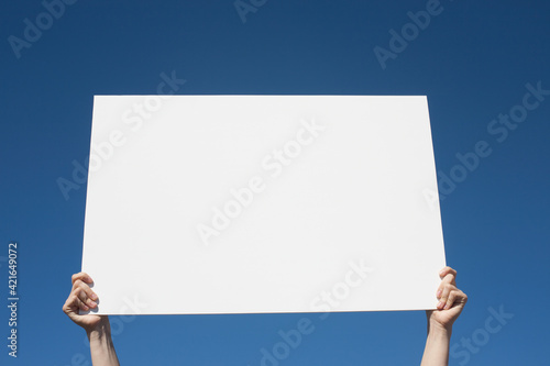 USA, Arizona, Holbrook, Human hands holding blank placard photo