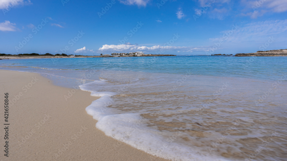 Beach in paradise with transparent water and blue sky.