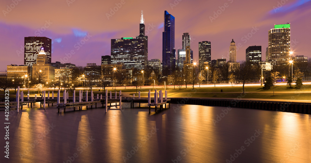 USA, Illinois, Chicago, City skyline and marina illuminated at dusk USA, Illinois, Chicago, City skyline and marina illuminated at dusk